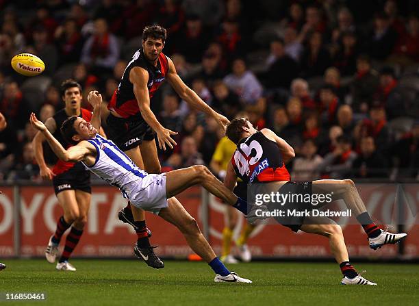 Patrick Ryder of the Bombers crashes over a pack during the round 13 AFL match between the Essendon Bombers and the North Melbourne Kangaroos at...