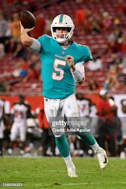 Jake Rudock of the Miami Dolphins throws an 8-yard towndown pass to Patrick Laird during the fourth quarter of a preseason football game against the...