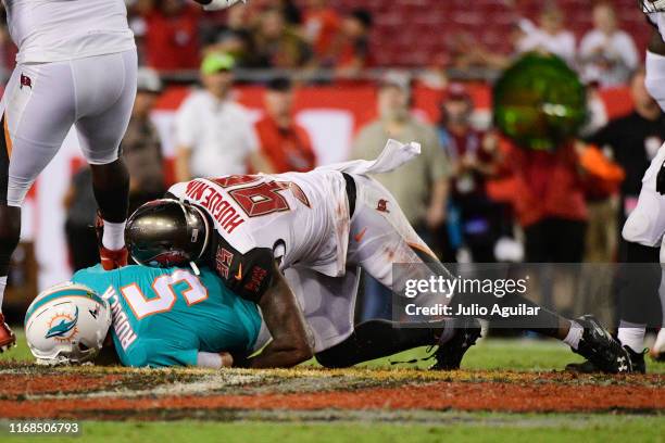 Farrington Huguenin of the Tampa Bay Buccaneers sacks Jake Rudock of the Miami Dolphins for a 10-yard loss during the fourth quarter of aa preseason...