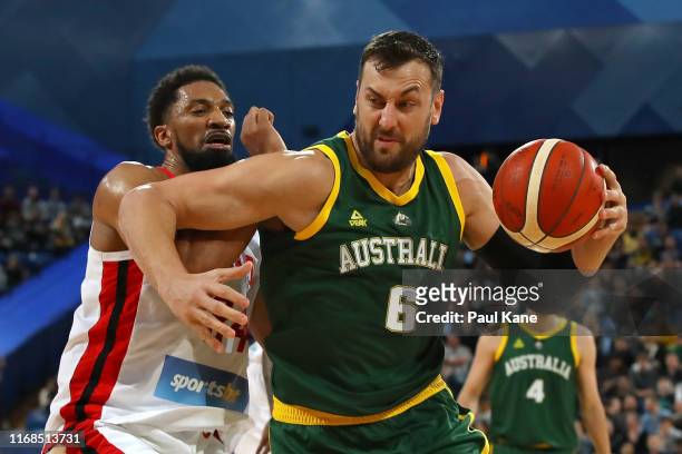 Andrew Bogut of Australia drives to the basket against Khem Birch of Canada during the International Basketball Friendly match between the Australian...