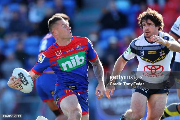 Shaun Kenny-Dowall of the Newcastle Knights runs the ball during the round 22 NRL match between the Newcastle Knights and the North Queensland...