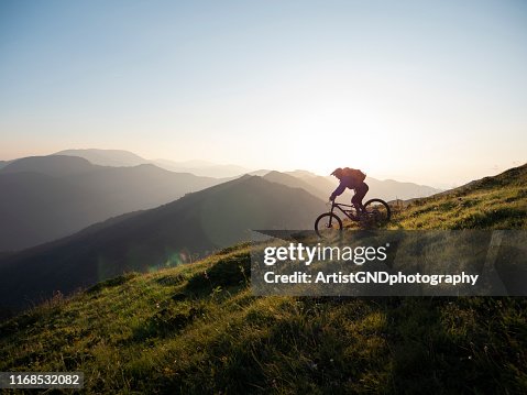 Mountain biker riding downhill Mountain biker riding downhill