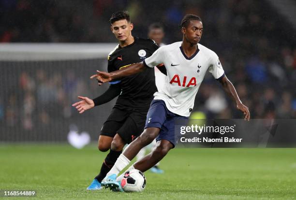 Paris Maghoma of Tottenham Hotspur runs with the ball under pressure from Nabili Zoubdi Touaizi of Manchester City during the Premier League 2 match...