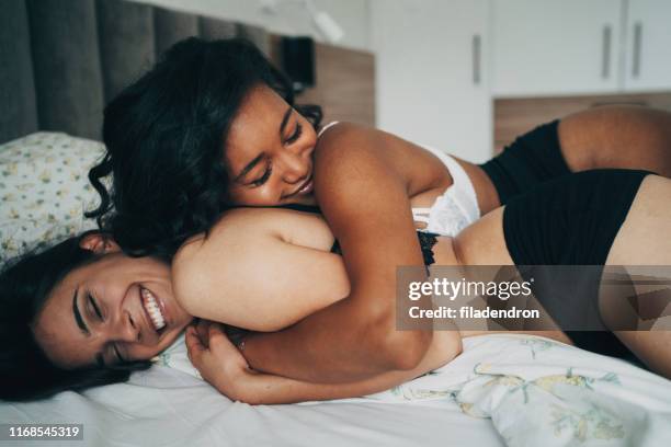 lesben paar - couple playful bedroom stock-fotos und bilder