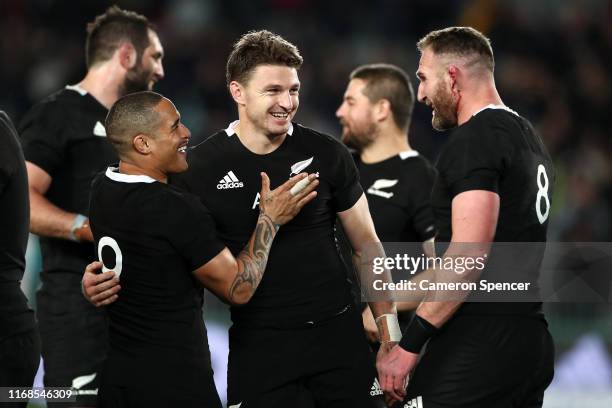 Aaron Smith of the All Blacks celebrates with Beauden Barrett of the All Blacks and Kieran Read of the All Blacks after winning The Rugby...