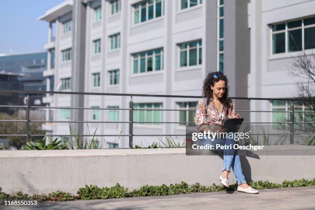 a young woman exploring a new city. - sandton cbd stock pictures, royalty-free photos & images