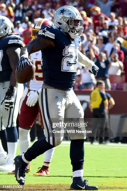 Ezekiel Elliott of the Dallas Cowboys celebrates after scoring a touchdown against the Washington Redskins during the second half at FedExField on...