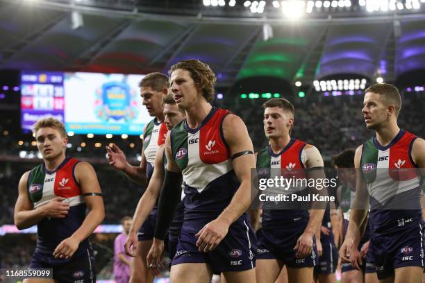 The Dockers walk to the rooms at the half time break during the round 22 AFL match between the Fremantle Dockers and the Essendon Bombers at Optus...