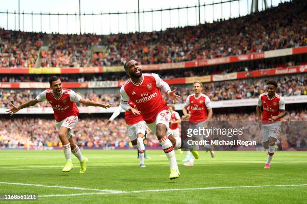 Alexandre Lacazette of Arsenal celebrates after scoring his team's first goal during the Premier League match between Arsenal FC and Burnley FC at...