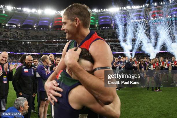 Aaron Sandilands and Hayden Ballantyne of the Dockers embrace after playing their final home game for the club during the round 22 AFL match between...