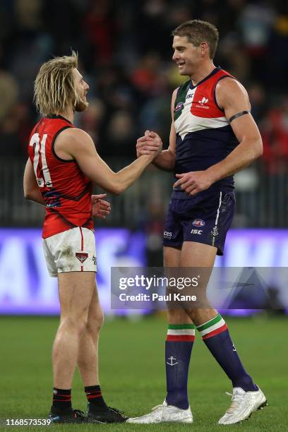 Dyson Heppell of the Bombers shakes hands with retiring Aaron Sandilands of the Dockers following the final siren during the round 22 AFL match...