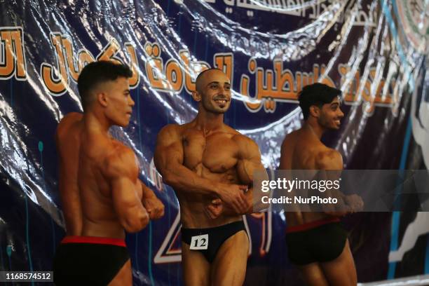 Gaza Bodybuilder Palestinian contestants performs on stage during a local bodybuilding ...