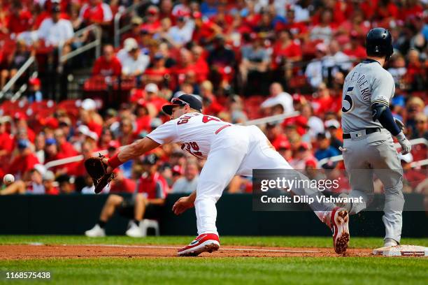 Cory Spangenberg of the Milwaukee Brewers beats the throw to first base against Paul Goldschmidt of the St. Louis Cardinals in the fifth inning at...