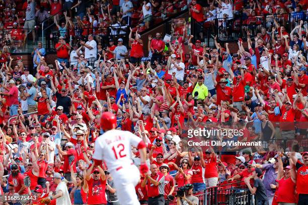 Fans cheer after Paul DeJong of the St. Louis Cardinals hit a two-run home run against the Milwaukee Brewers in the seventh inning at Busch Stadium...