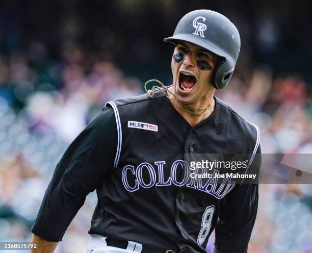 Josh Fuentes of the Colorado Rockies reacts to his three-run home run against the San Diego Padres in the seventh inning at Coors Field on September...