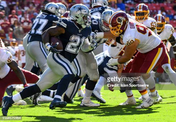Dallas Cowboys running back Ezekiel Elliott runs for a long gain against Washington Redskins defensive end Matthew Ioannidis on September 15 at FedEx...