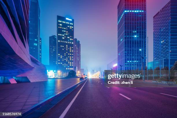 urban streets after rain - downtown neon stock-fotos und bilder