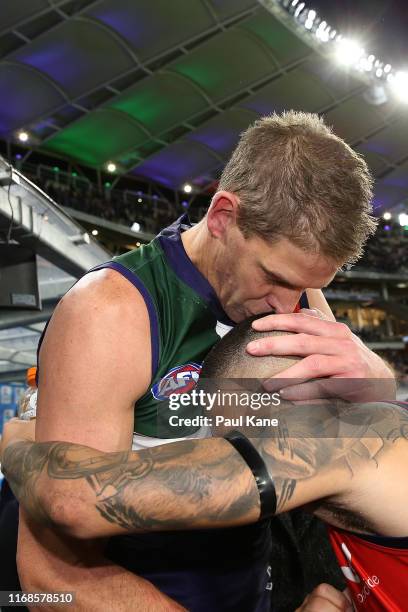 Aaron Sandilands and Michael Walters of the Dockers share a moment after being defeated during the round 22 AFL match between the Fremantle Dockers...