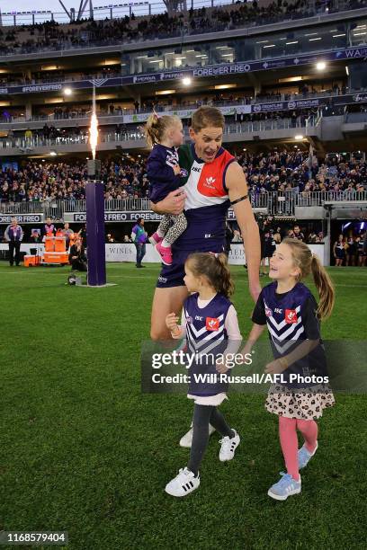 Aaron Sandilands of the Dockers walks out with his kids during the round 22 AFL match between the Fremantle Dockers and the Essendon Bombers at Optus...