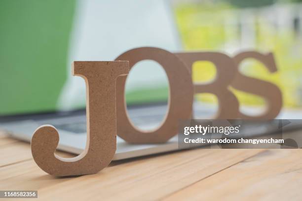 technology computer and job occupation concept, searching information data creative idea and wooden with text in on laptop. - vacancy stock pictures, royalty-free photos & images