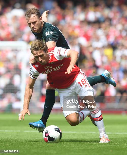 Nacho Monreal of Arsenal takes on Ashley Barnes of Burnley during the Premier League match between Arsenal FC and Burnley FC at Emirates Stadium on...