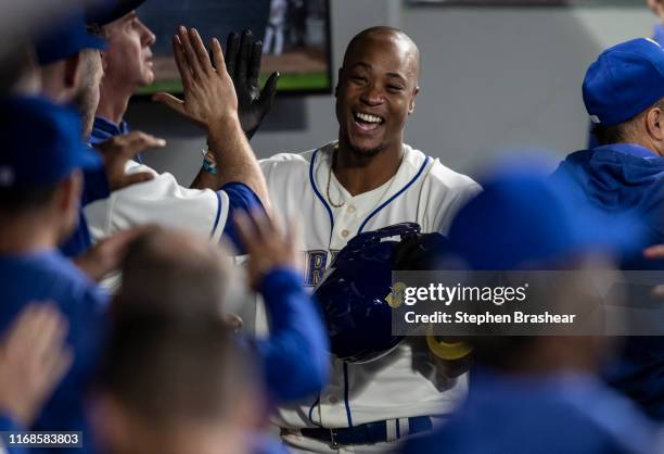 Keon Broxton of the Seattle Mariners celebrates in the dugout after scoring a run on single by Mallex Smith of the Seattle Mariners off of relief...