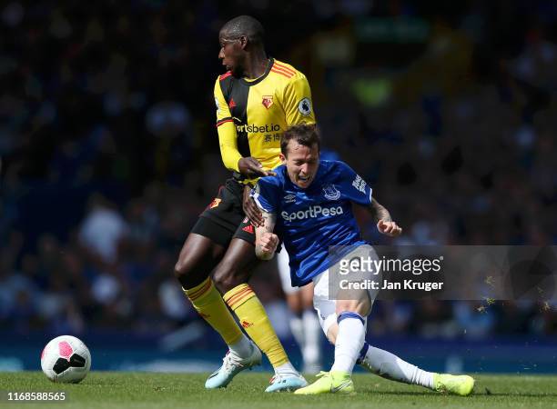 Bernard of Everton is tackled by Adrian Mariappa of Watford during the Premier League match between Everton FC and Watford FC at Goodison Park on...