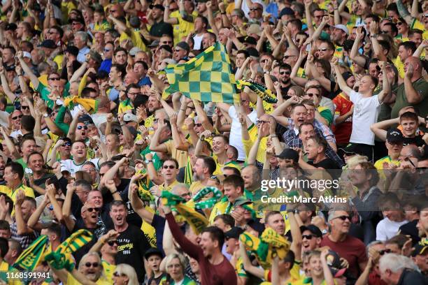 Norwich City fans show their support during the Premier League match between Norwich City and Newcastle United at Carrow Road on August 17, 2019 in...