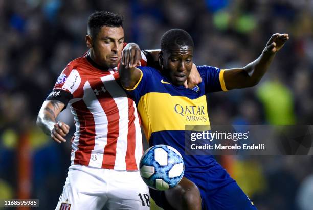 Jan Hurtado of Boca Juniors fights for the ball with Gonzalo Jara of Estudiantes during a match between Boca Juniors and Estudiantes de La Plata as...