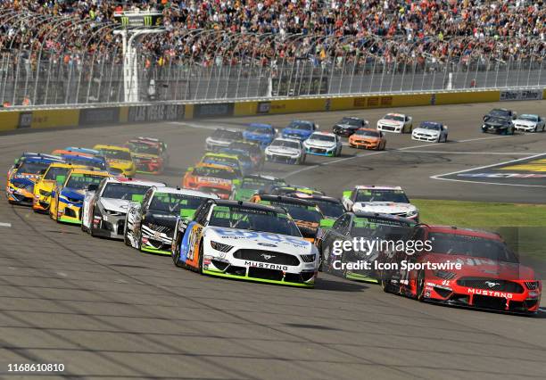 Monster Energy NASCAR Cup Series pole sitter Clint Bowyer Stewart Haas Racing Ford Mustang leads the field towards turn one after taking the green...