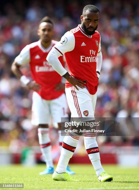 Pierre-Emerick Aubameyang and Alexandre Lacazette of Arsenal look on during the Premier League match between Arsenal FC and Burnley FC at Emirates...