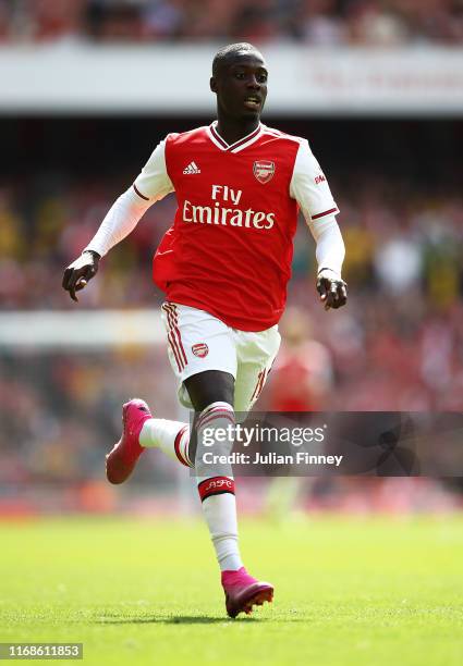 Nicolas Pepe of Arsenal in action during the Premier League match between Arsenal FC and Burnley FC at Emirates Stadium on August 17, 2019 in London,...