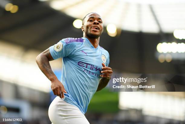 Raheem Sterling of Manchester City celebrates after scoring his team's first goal during the Premier League match between Manchester City and...