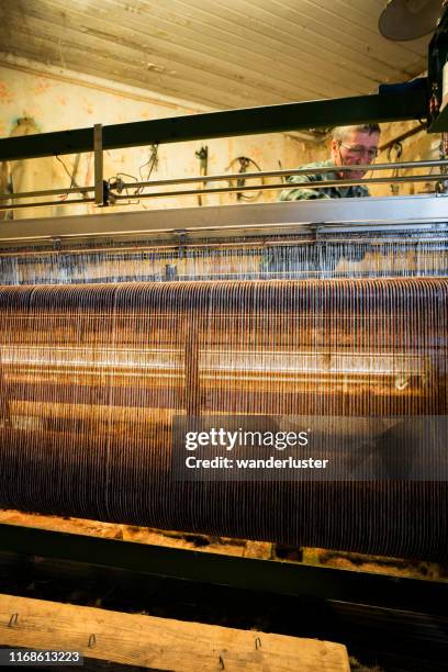 man weaving tweed cloth - loom stock pictures, royalty-free photos & images