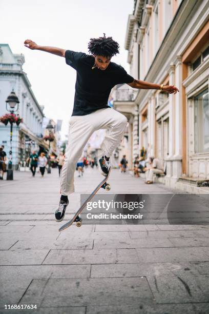 ollie tricks in downtown - stunt stock pictures, royalty-free photos & images