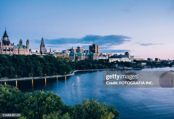 canadian parliament on ottawa river (dusk) - climate london stock pictures, royalty-free photos & images