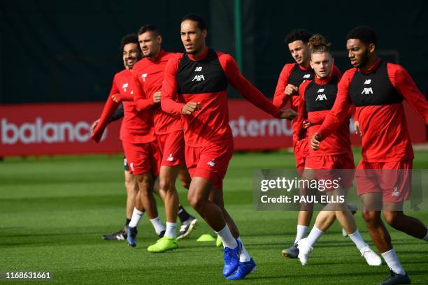 Liverpool's Dutch defender Virgil van Dijk takes part in a training session at their Melwood complex, Liverpool,north west England n the eve of their...
