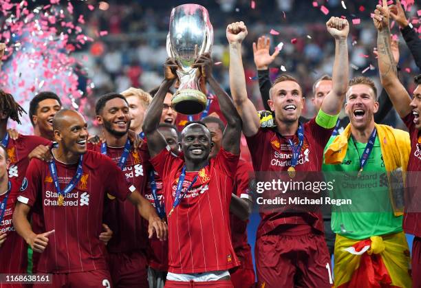 Sadio Mane of Liverpool lifts the UEFA Super Cup trophy as Liverpool celebrate victory following the UEFA Super Cup match between Liverpool and...
