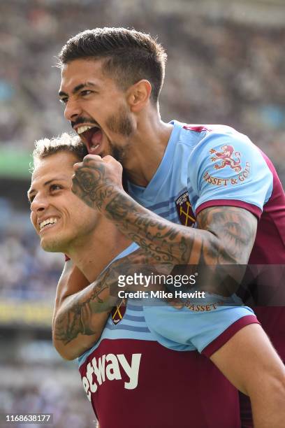 Javier Hernandez of West Ham United celebrates with Manuel Lanzini after scoring during the Premier League match between Brighton & Hove Albion and...