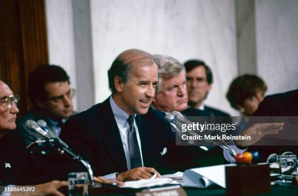 Senate Judiciary Committee Chairman Joe Biden, left, gestures while asking a procedural question during hearings before the committee on the...