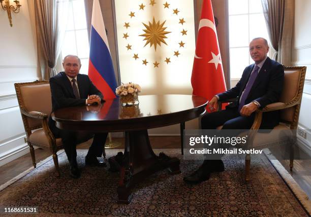 Russian President Vladimir Putin greets Israeli Prime Minister Benjamin Netanyahu during their meeting at Bocharov Ruchey State Residence in Sochi,...