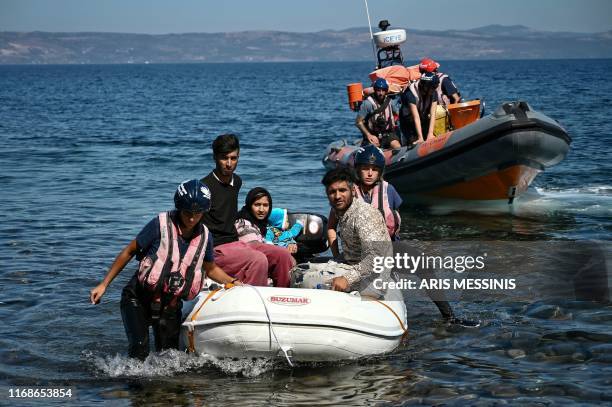 Migrants helped by rescuers arrive on the Greek island of Lesbos after crossing the Aegean Sea from Turkey, on September 16, 2019. Migration is a hot...