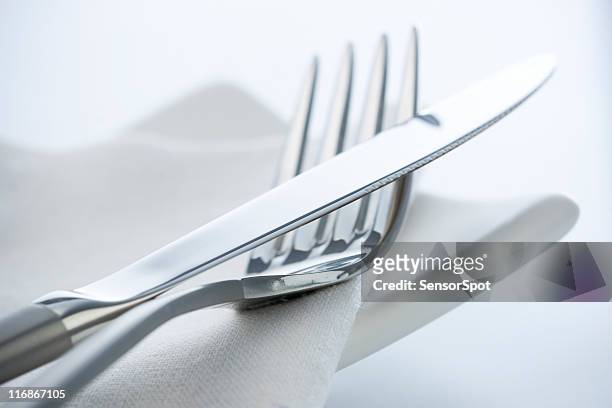 fork and knife - eetgerei stockfoto's en -beelden
