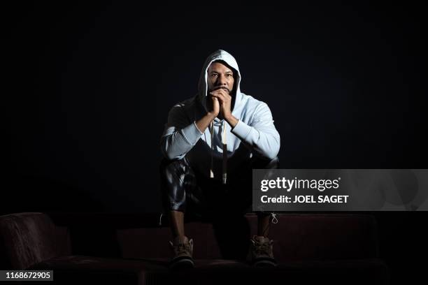 American rapper, actor, writer and activist Lonnie Corant Jaman Shuka Rashid Lynn better known by his stage name Common poses during a photo session...