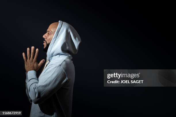 Rapper, actor, writer and activist Lonnie Corant Jaman Shuka Rashid Lynn better known by his stage name Common poses during a photo session in Paris...