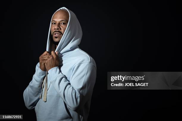 American rapper, actor, writer and activist Lonnie Corant Jaman Shuka Rashid Lynn better known by his stage name Common poses during a photo session...