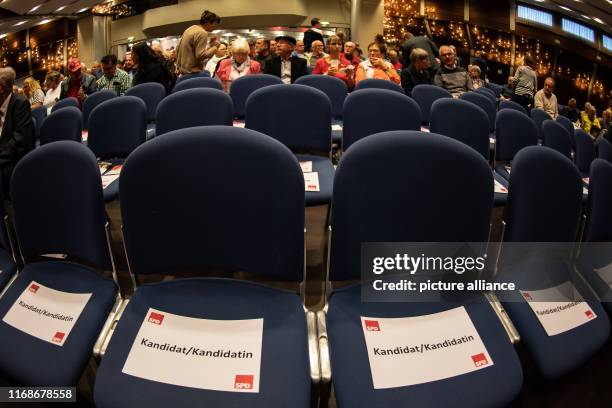 September 2019, Hessen, Baunatal: Leaves with the inscription "Candidate" are on chairs in the first row at a regional conference on party...