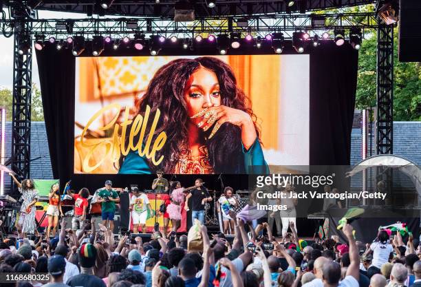 British R&B and Rap musician, producer, and actress Estelle performs onstage, surrounded by audience members, during the VP Records 40th anniversary...