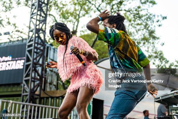 British R&B and Rap musician, producer, and actress Estelle dances with an unidentified member of the audience as she performs onstage at the VP...