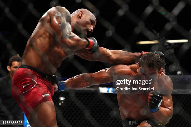 Paulo Costa throws a punch at Yoel Romero in the third round during their Middleweight Bout at UFC 241 at Honda Center on August 17, 2019 in Anaheim,...